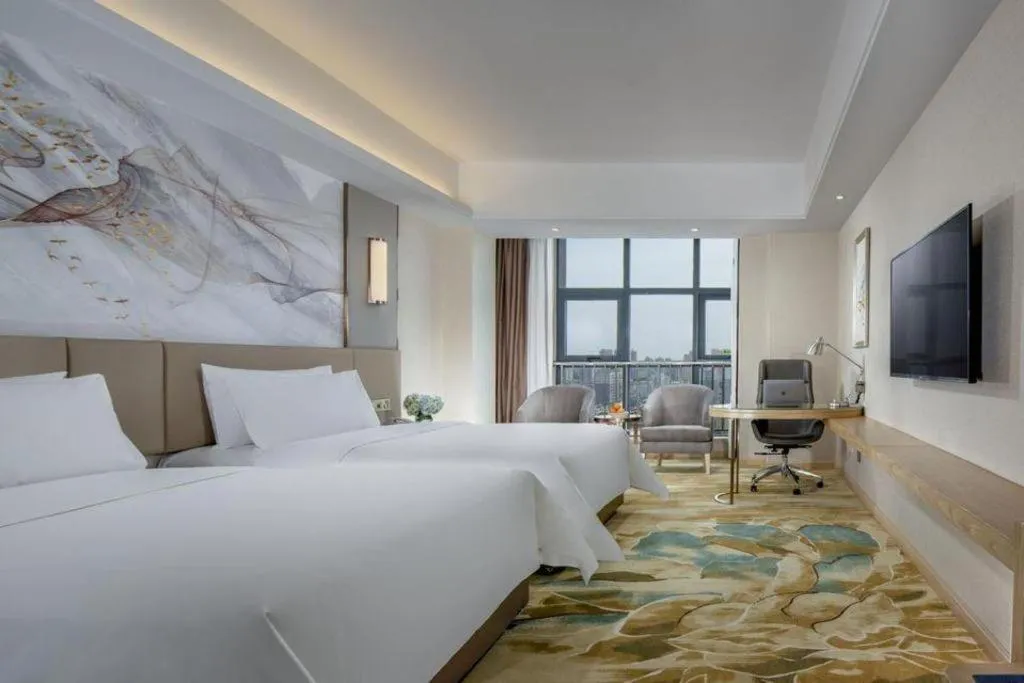 Bed in Vienna Hotel Shaanxi Hanzhong Central Square High-Speed Railway Station