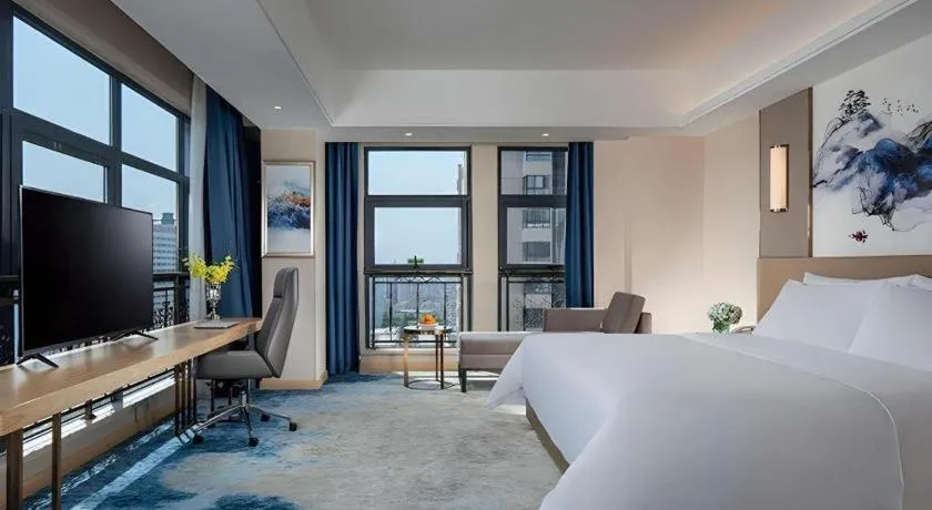 Bed in Vienna Hotel Shaanxi Hanzhong Central Square High-Speed Railway Station