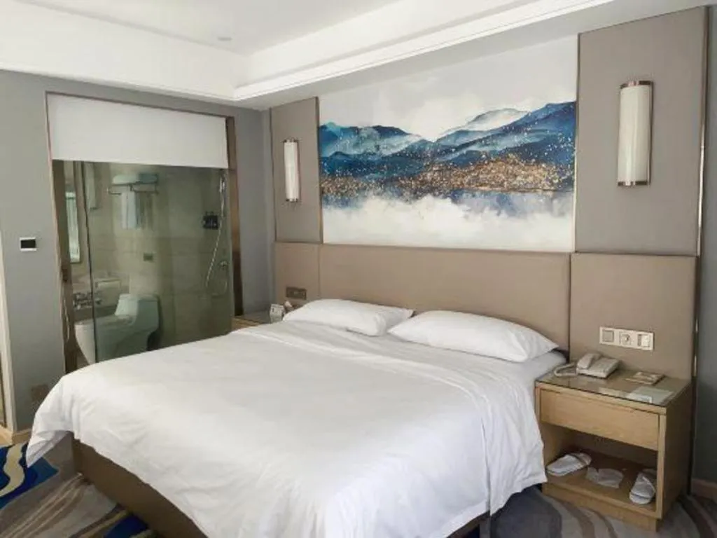 Bed in Vienna Hotel Shaanxi Hanzhong Central Square High-Speed Railway Station
