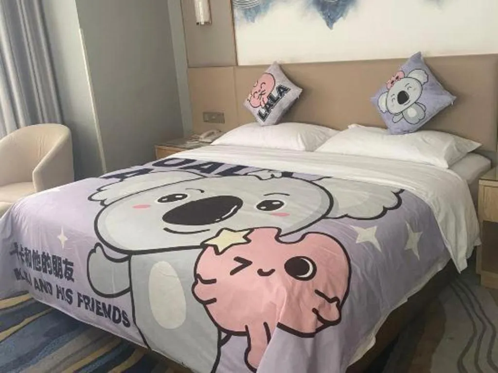 Bed in Vienna Hotel Shaanxi Hanzhong Central Square High-Speed Railway Station