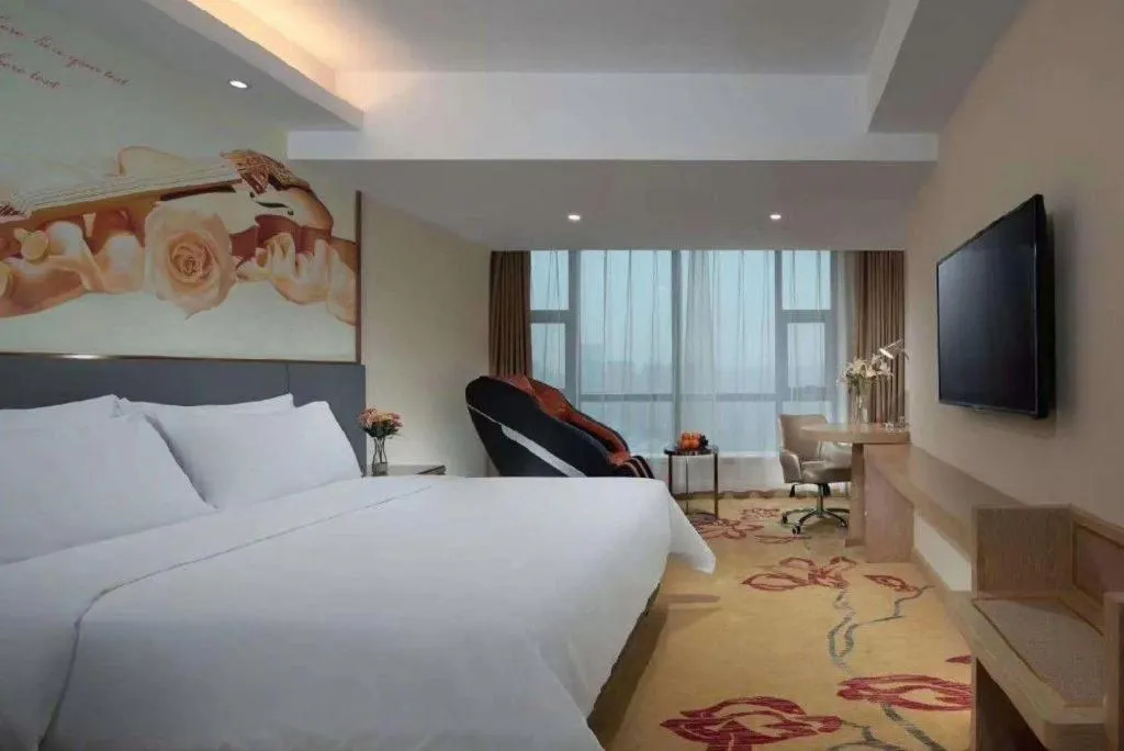 Bed in Vienna Hotel Shaanxi Hanzhong Central Square High-Speed Railway Station