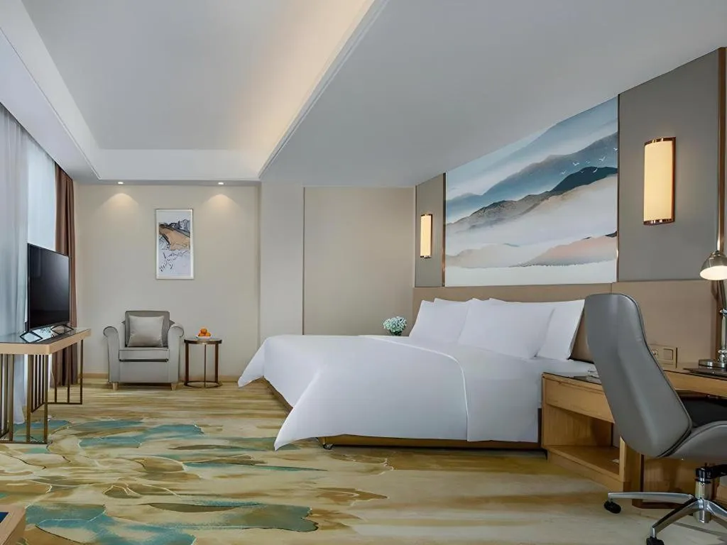 Bed in Vienna Hotel Shaanxi Hanzhong Central Square High-Speed Railway Station