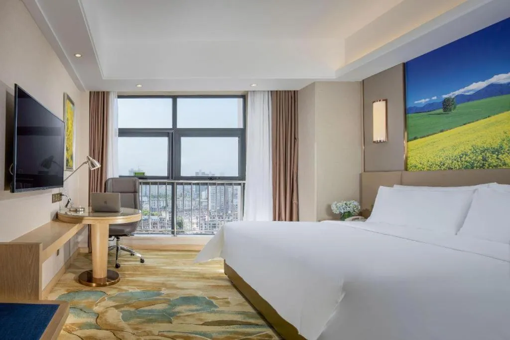 Bed in Vienna Hotel Shaanxi Hanzhong Central Square High-Speed Railway Station