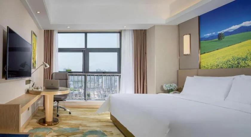 Bed in Vienna Hotel Shaanxi Hanzhong Central Square High-Speed Railway Station