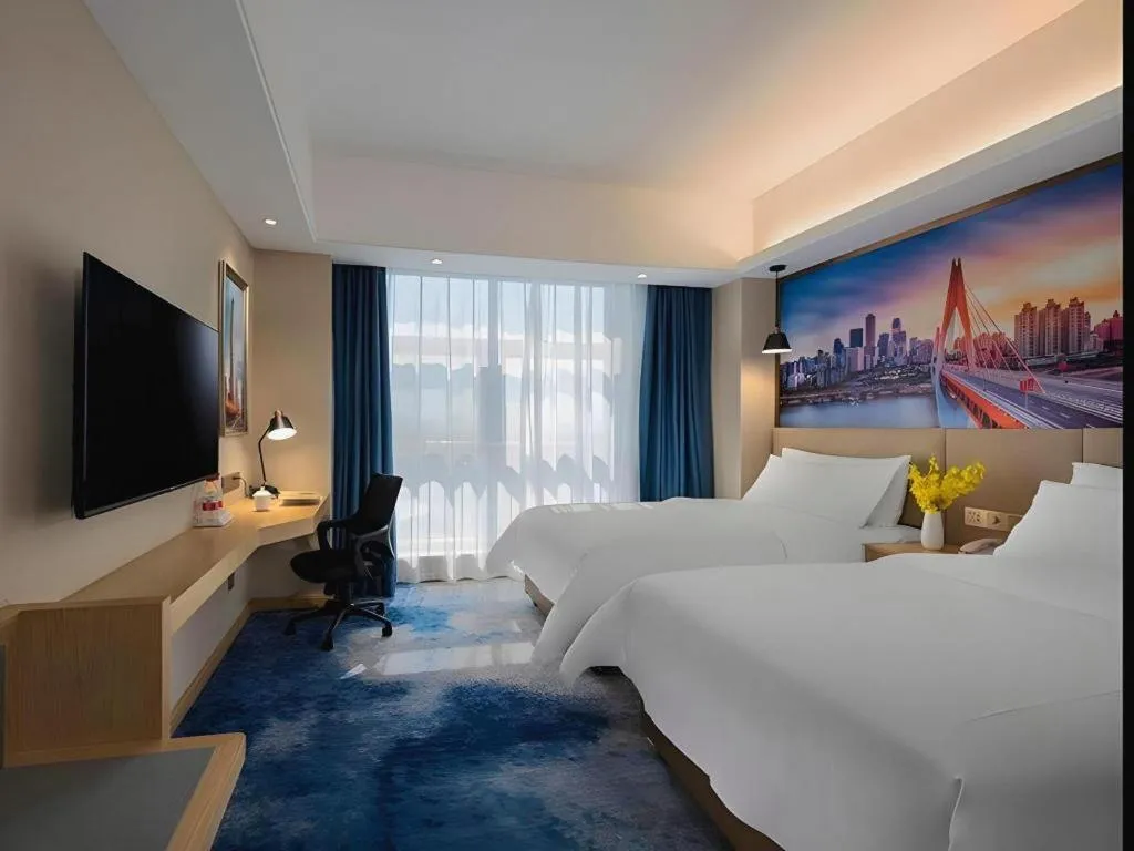 Bed in Vienna Hotel Shaanxi Hanzhong Central Square High-Speed Railway Station