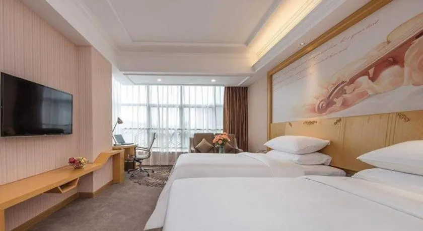 Bed in Vienna Hotel Guangzhou North Station Huaguoshan Metro Station