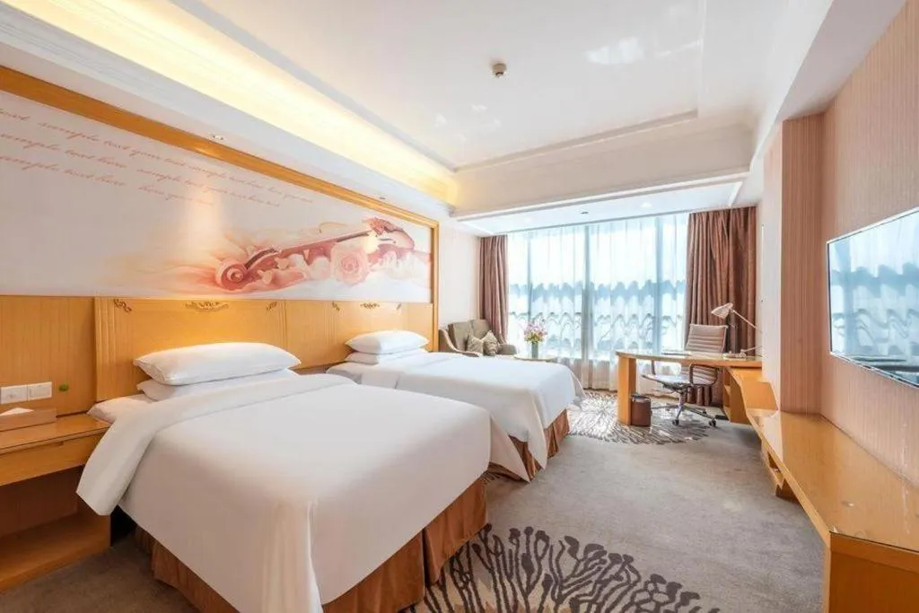 Bed in Vienna Hotel Guangzhou North Station Huaguoshan Metro Station