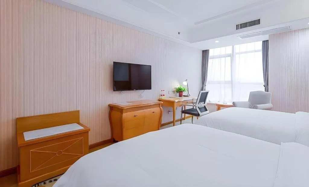 Bed in Vienna Hotel Shaanxi Ankang Jiangnan