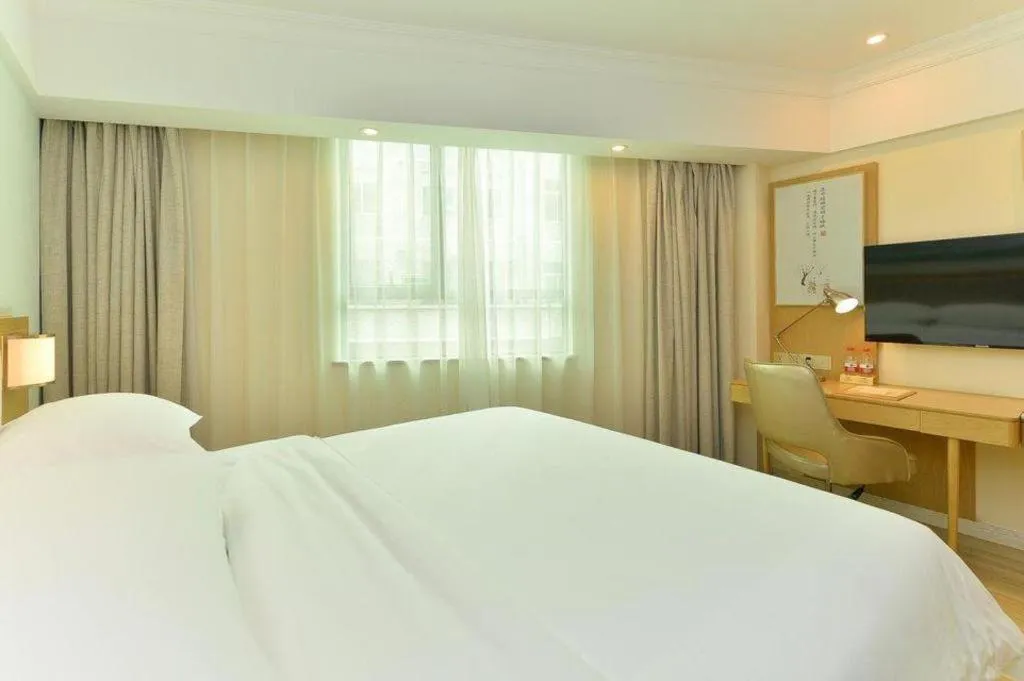 Bed in Vienna Hotel Guangdong Foshan Shunde Longjiang Material City