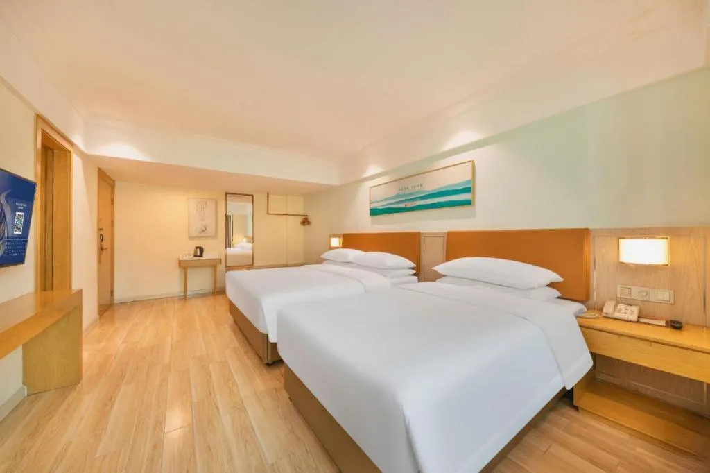 Bed in Vienna Hotel Guangdong Foshan Shunde Longjiang Material City