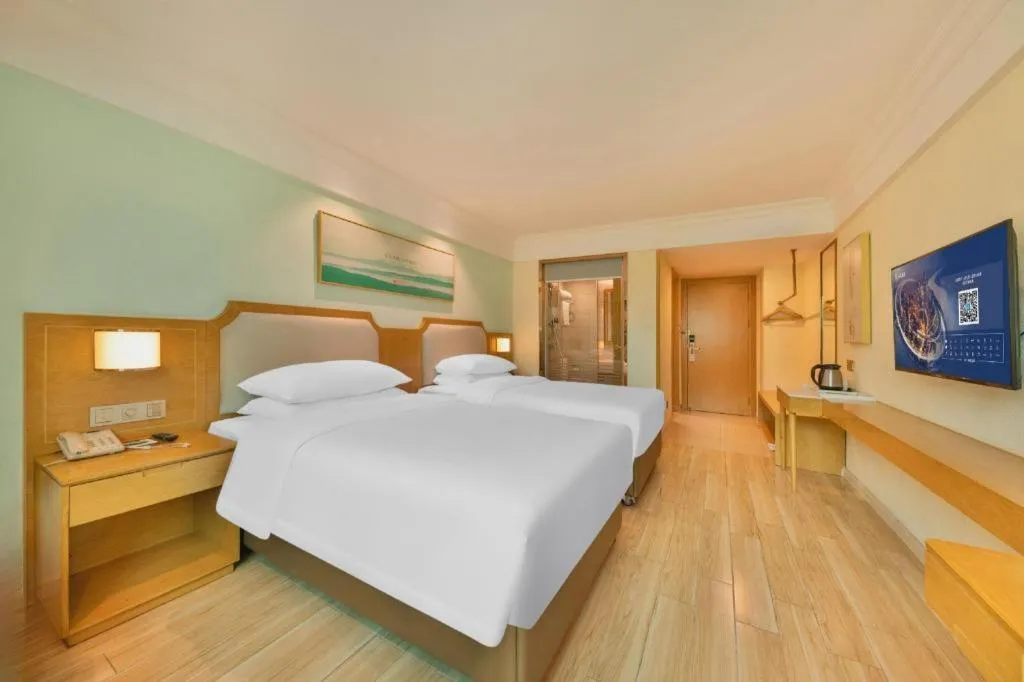 Bed in Vienna Hotel Guangdong Foshan Shunde Longjiang Material City