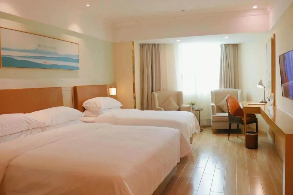 Bed in Vienna Hotel Guangdong Foshan Shunde Longjiang Material City