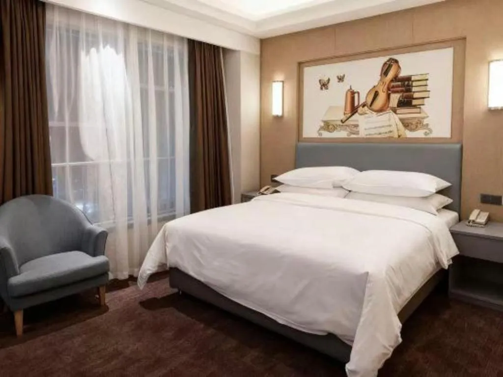 Bed in Vienna Hotel Guangdong Foshan West Station Airport Luocun