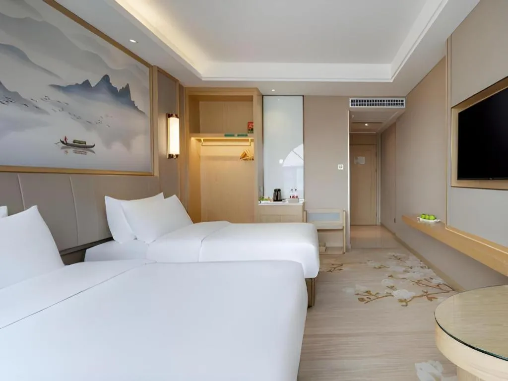 Bed in Vienna Hotel Yunnan Dali Erhai Lake