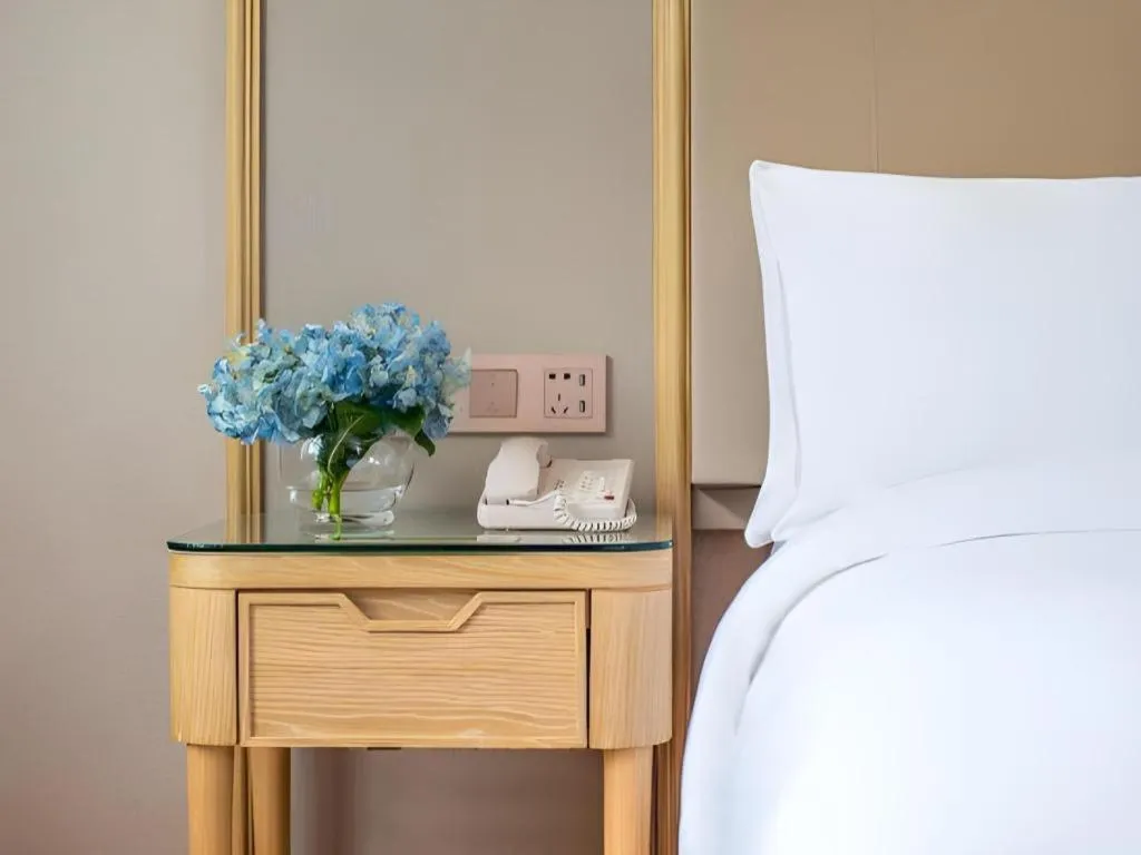 Bed in Vienna Hotel Yunnan Dali Erhai Lake