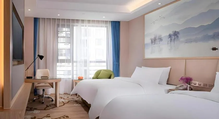 Bed in Vienna Hotel Yunnan Dali Erhai Lake