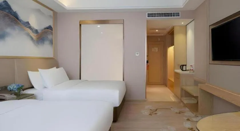 Bed in Vienna Hotel Yunnan Dali Erhai Lake