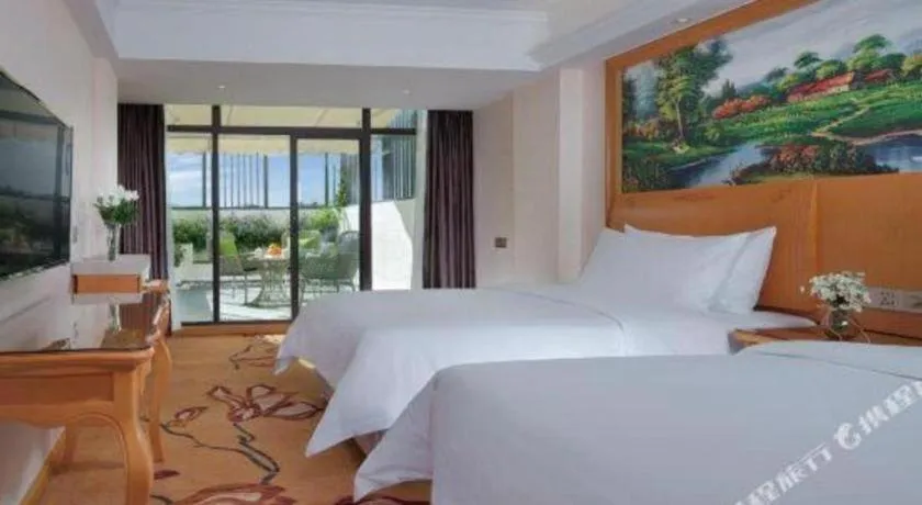 Bed in Vienna Hotel Kunming Beijing Road Chuanxin Gulou Metro Station