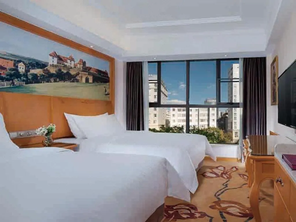 Bed in Vienna Hotel Kunming Beijing Road Chuanxin Gulou Metro Station