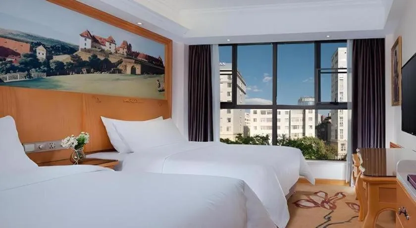 Bed in Vienna Hotel Kunming Beijing Road Chuanxin Gulou Metro Station