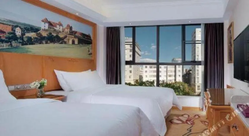 Bed in Vienna Hotel Kunming Beijing Road Chuanxin Gulou Metro Station