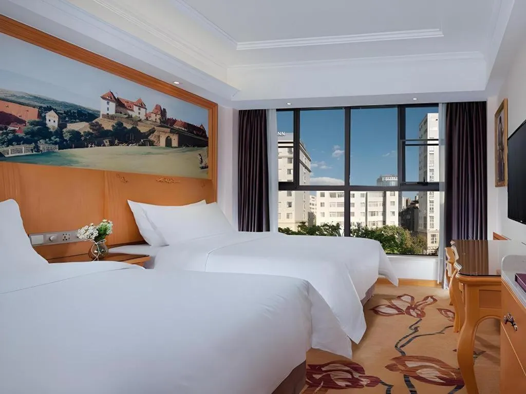 Bed in Vienna Hotel Kunming Beijing Road Chuanxin Gulou Metro Station