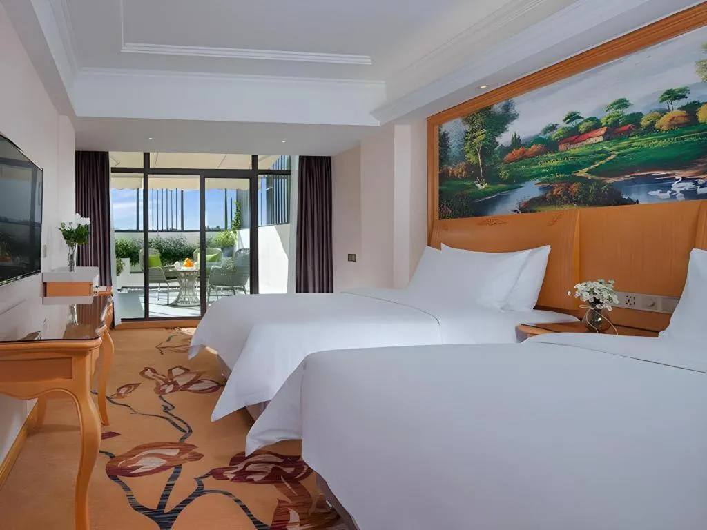 Bed in Vienna Hotel Kunming Beijing Road Chuanxin Gulou Metro Station