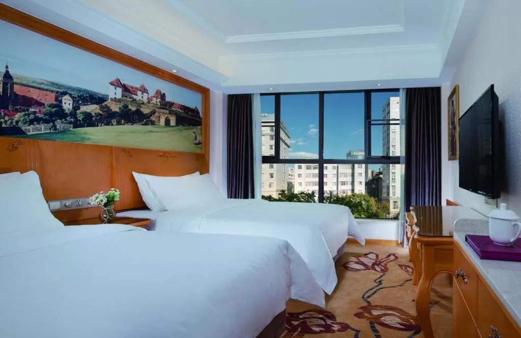 Bed in Vienna Hotel Kunming Beijing Road Chuanxin Gulou Metro Station