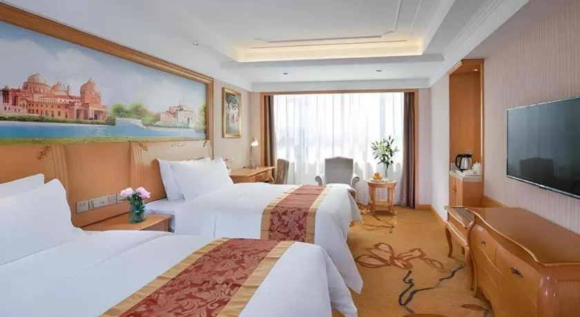 Bed in Vienna Hotel Ganzhou Economic Development Zone 1st Hospital West High-Speed Railway Station