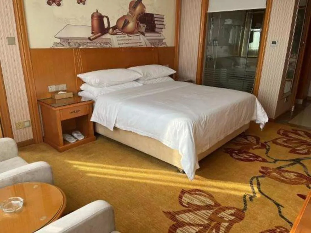 Bed in Vienna Hotel Ganzhou Economic Development Zone 1st Hospital West High-Speed Railway Station