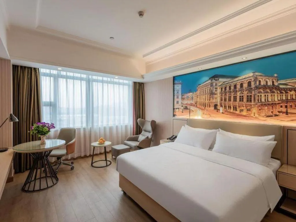 Bed in Vienna Hotel Ganzhou Economic Development Zone 1st Hospital West High-Speed Railway Station