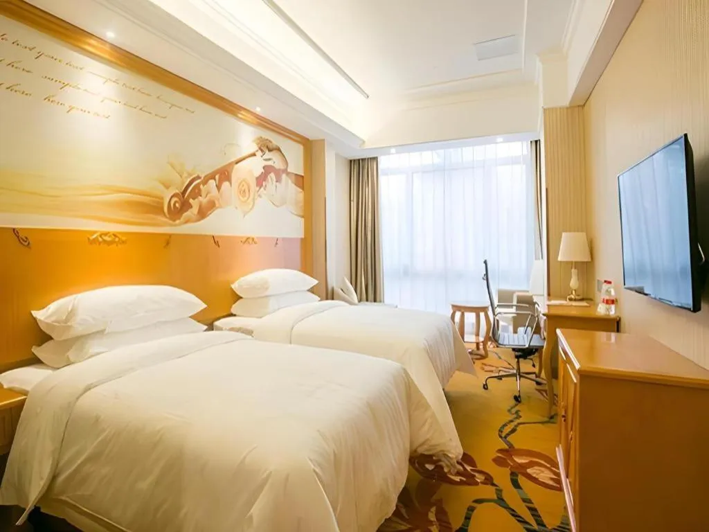 Bed in Vienna Hotel Shanghai Hongqiao National Exhibition Cente Sijing Metro Station