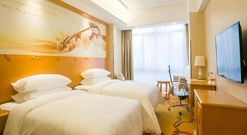 Bed in Vienna Hotel Shanghai Hongqiao National Exhibition Cente Sijing Metro Station
