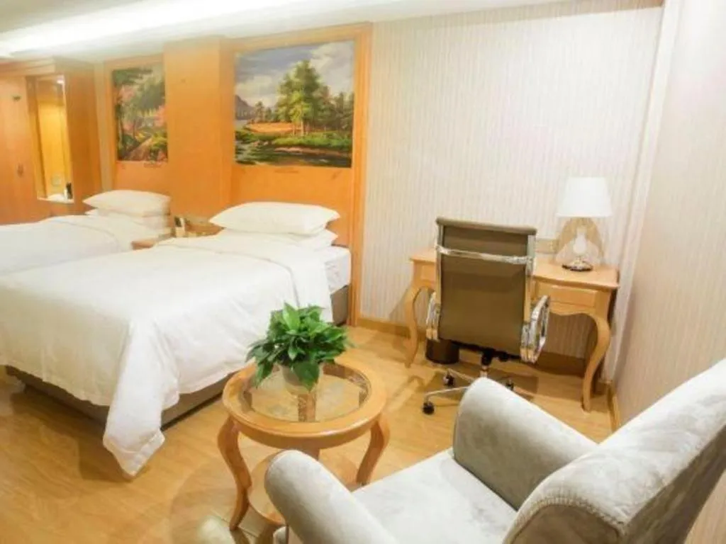 Bed in Vienna Hotel Shanghai Hongqiao National Exhibition Cente Sijing Metro Station