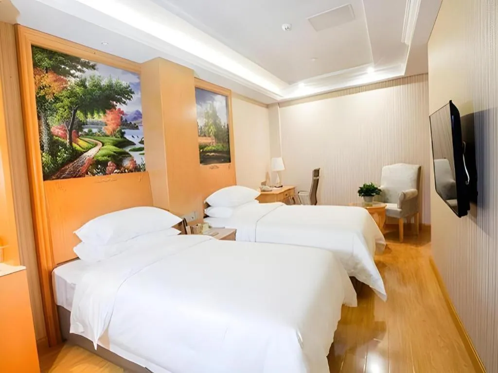 Bed in Vienna Hotel Shanghai Hongqiao National Exhibition Cente Sijing Metro Station