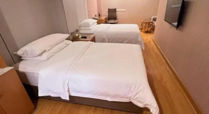 Bed in Vienna Hotel Shanghai Hongqiao National Exhibition Cente Sijing Metro Station