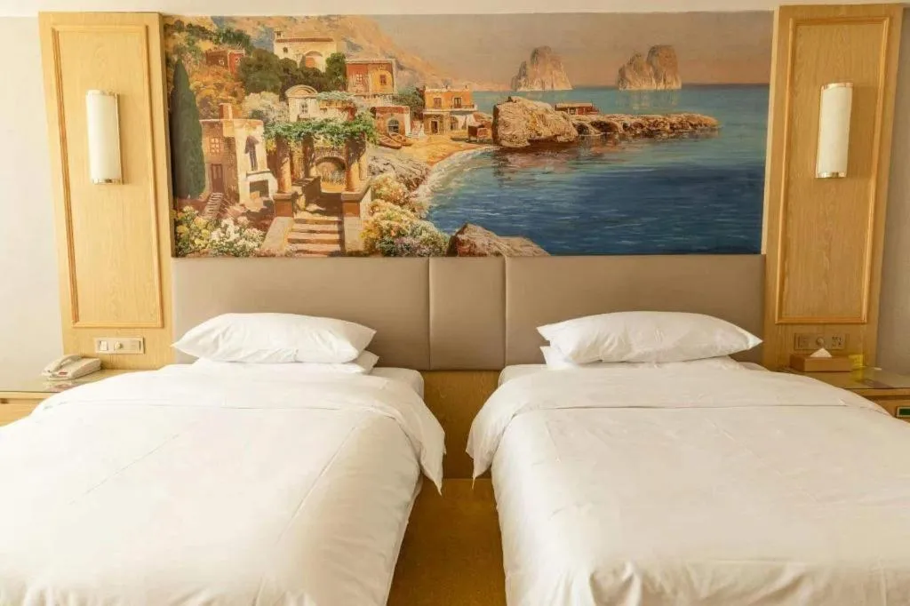 Bed in Vienna Hotel Shandong Linyi Mengyin