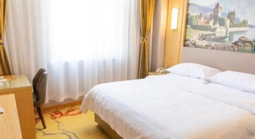 Bed in Vienna Hotel Shandong Linyi Mengyin