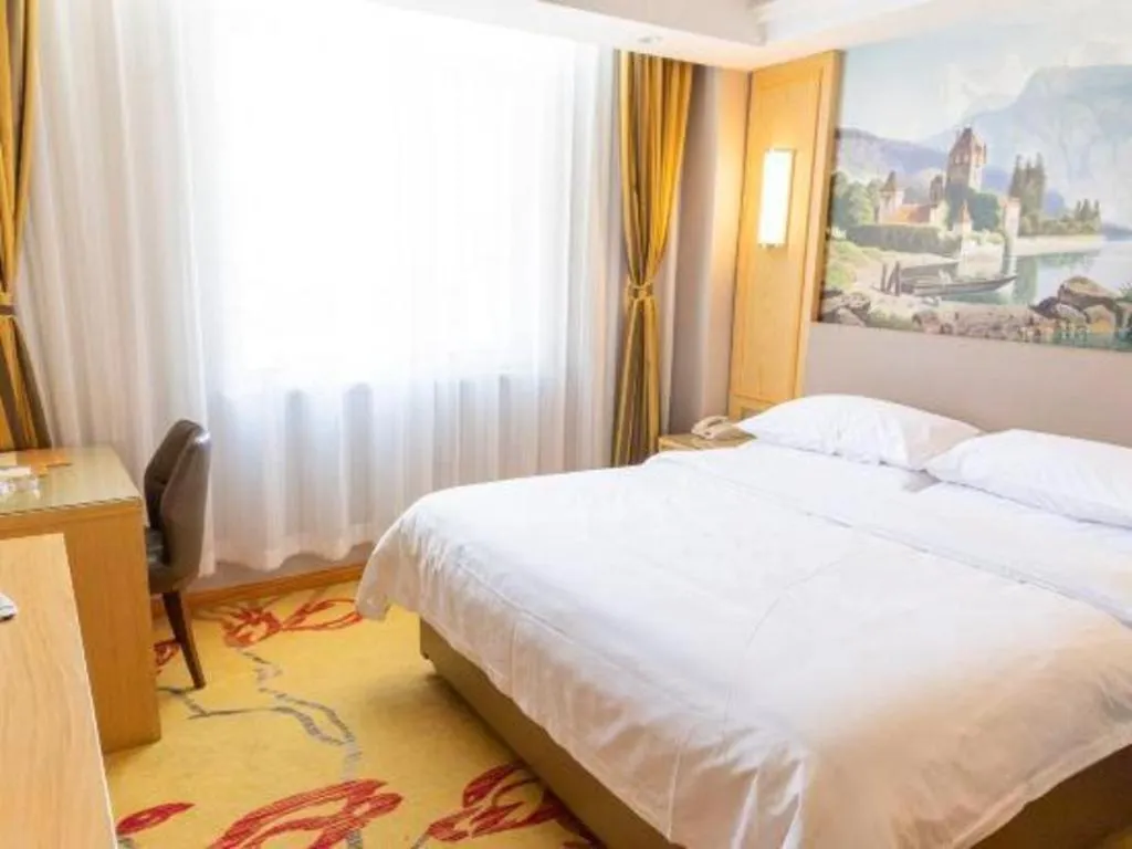 Bed in Vienna Hotel Shandong Linyi Mengyin