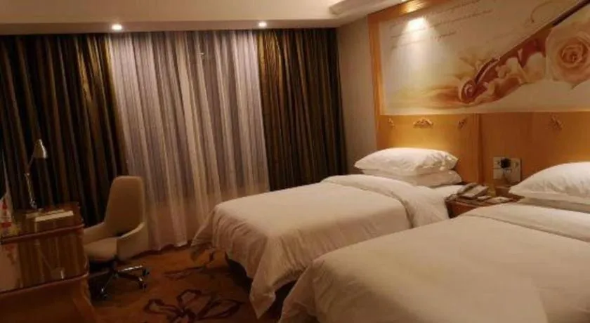 Bed in Vienna Hotel Guangdong Zhaoqing Sihui Tianguangxu