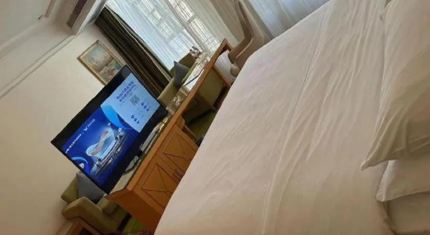 Bed in Vienna Hotel Guangdong Zhaoqing Sihui Tianguangxu