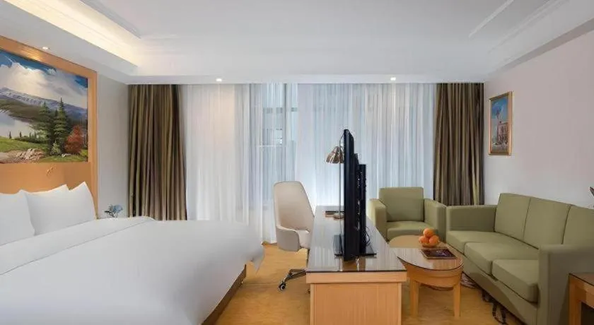 Bed in Vienna Hotel Guangdong Zhaoqing Sihui Tianguangxu