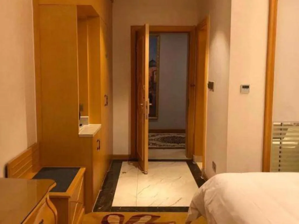 Bed in Vienna Hotel Guangdong Zhaoqing Sihui Tianguangxu