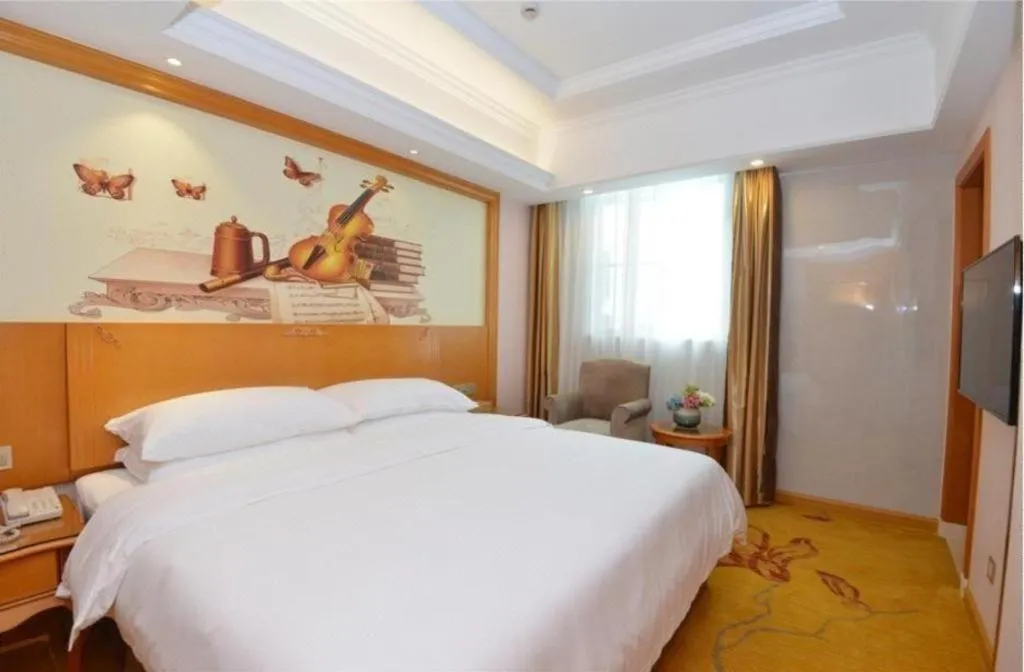 Bed in Vienna Hotel Shanghai Songjiang Market Miaoqian Street