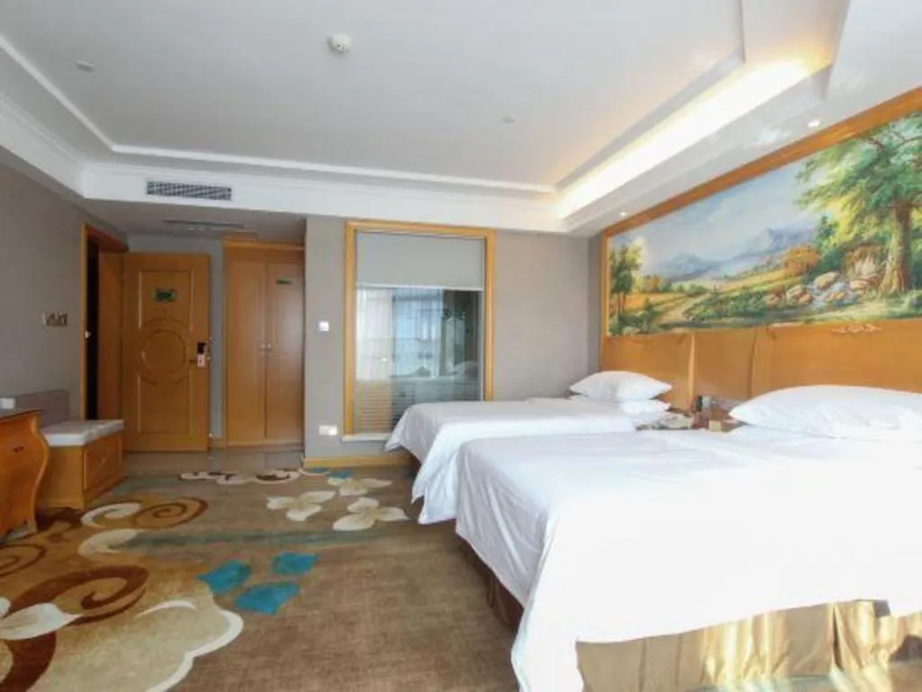 Bed in Vienna Hotel Guangdong Zhongshan Ancient Town Haizhou