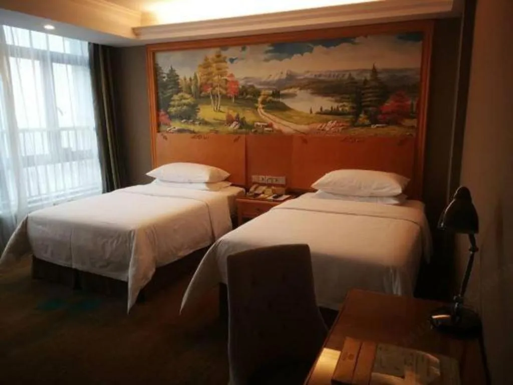 Bed in Vienna Hotel Guangdong Zhongshan Ancient Town Haizhou