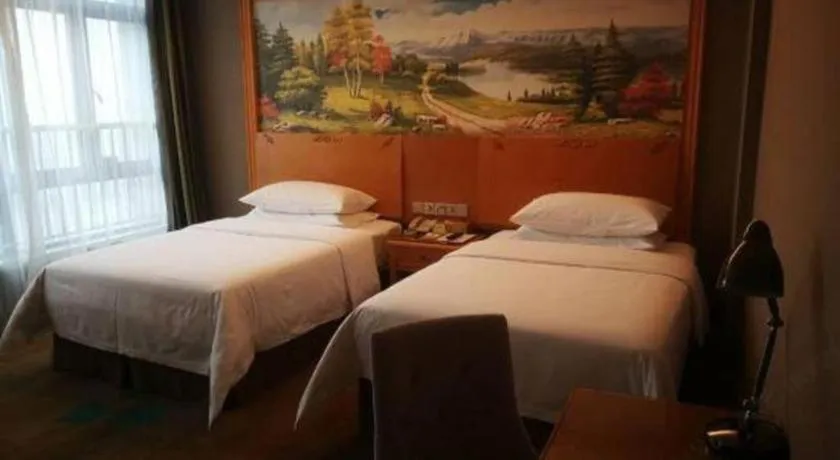 Bed in Vienna Hotel Guangdong Zhongshan Ancient Town Haizhou