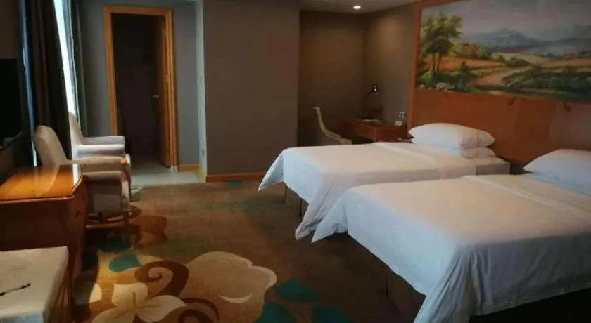 Bed in Vienna Hotel Guangdong Zhongshan Ancient Town Haizhou