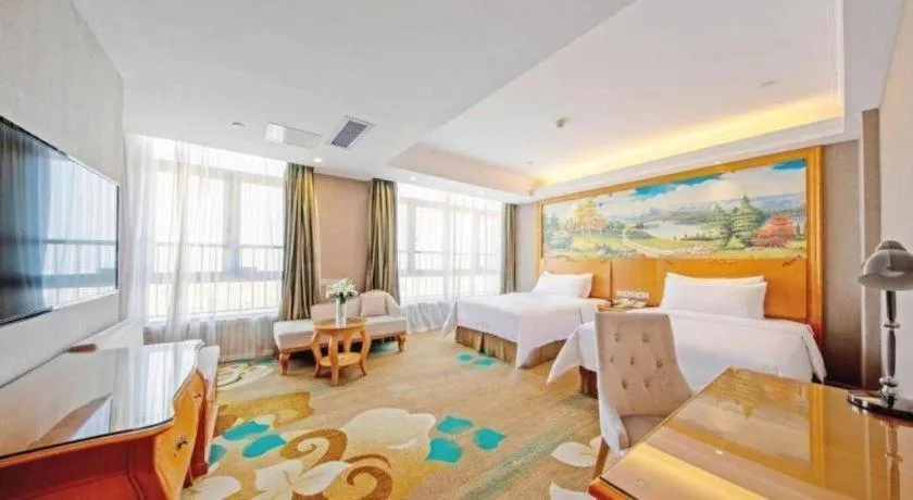 Bed in Vienna Hotel Guangdong Zhongshan Ancient Town Haizhou