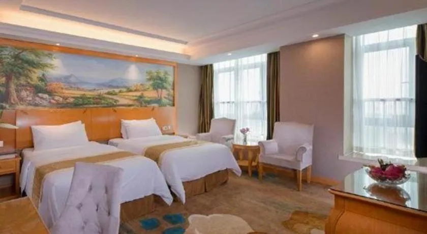 Bed in Vienna Hotel Guangdong Zhongshan Ancient Town Haizhou